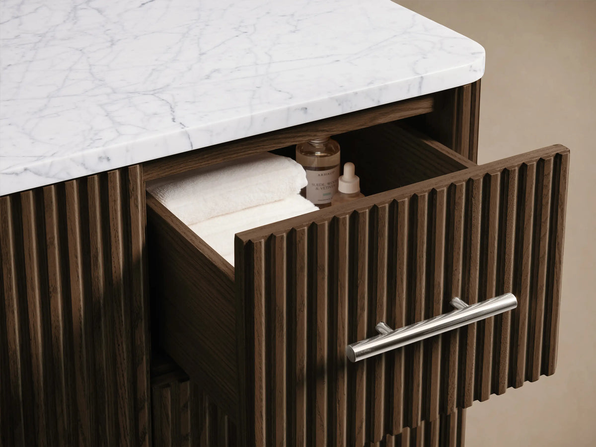 Finnley Wide Single Vanity: Top view of marble countertop with oval sink & 3 faucet holes, dark wood slatted base.