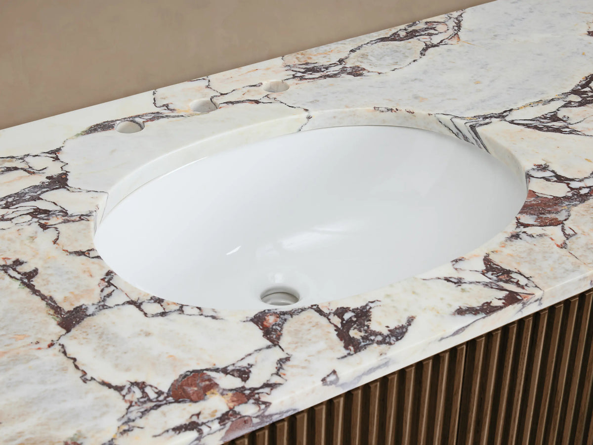 Finnley Single Vanity with white oval sink, veined marble countertop, dark bronze faucet, and dark wood slatted base.