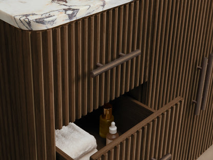 Close-up of Finnley Wide Single Vanity with Calacatta Viola marble top, white oval sink, & 3 faucet holes. Dark ribbed wood base.
