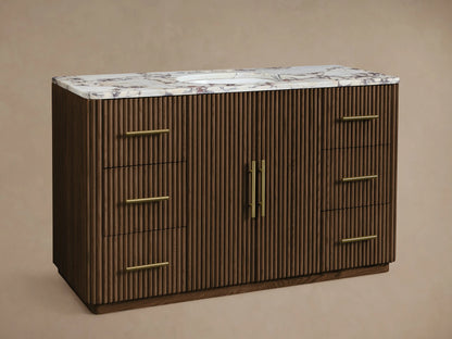 Finnley Wide Single Vanity: dark brown fluted wood cabinet, white marble top with reddish-brown veins & white sink, gold bar handles.
