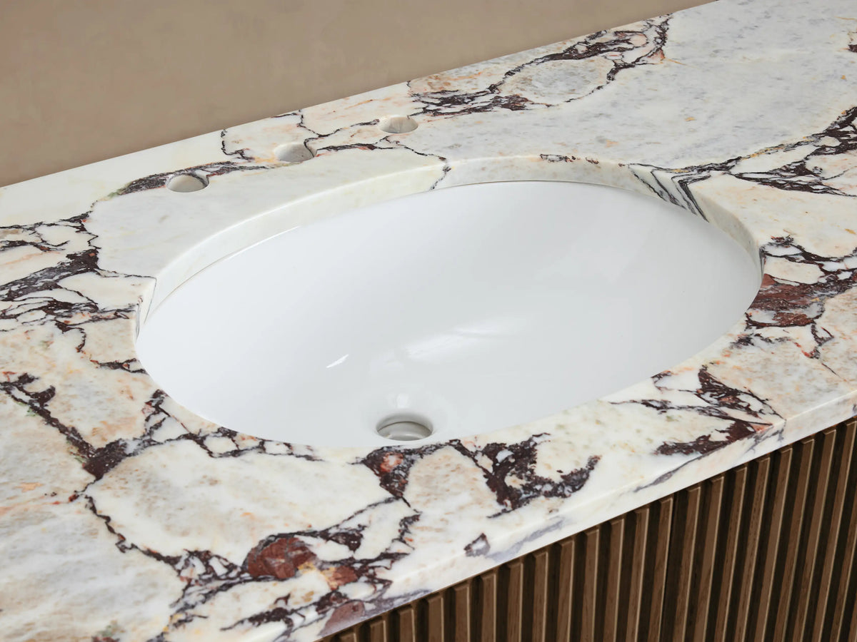 Finnley Single Vanity: White oval sink in Calacatta Viola marble top with red veining, polished chrome faucet, slatted wood base.