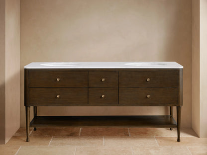 Laurent Double Vanity: dark brown wood with white marble top, two sinks, bronze faucets, six drawers, and open shelf.