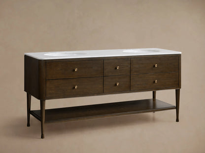 Laurent Double Vanity. Dark Bahasa Brown wood vanity with white Carrara marble top & oval sink. Top drop-down drawer open, brass knobs.