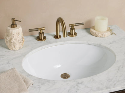 Laurent Single Vanity, dark brown wood with white marble top & oval sink. Two drawers have brass knobs; tapered legs support a shelf.