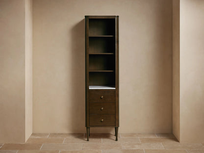 Tall Laurent Bath Cabinet, dark wood, white marble, 4 shelves with towels & decor, 3 drawers, brass pulls.