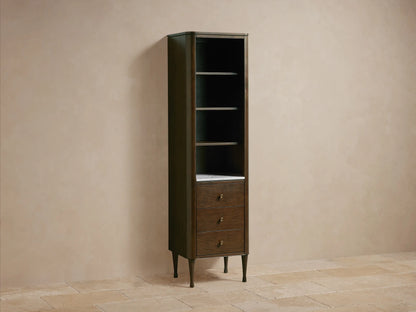 Close-up of Laurent Tall Bath Cabinet interior with dark brown wood shelves and white Carrara marble bottom.