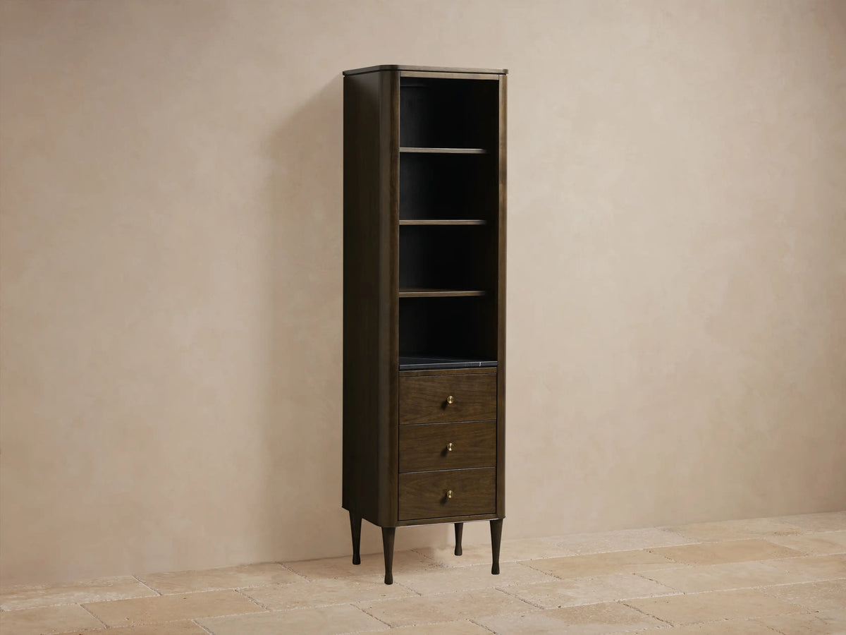 Close-up of Laurent Tall Bath Cabinet interior. Dark brown wood upper shelf and Black Marquina marble lower shelf with white veins.
