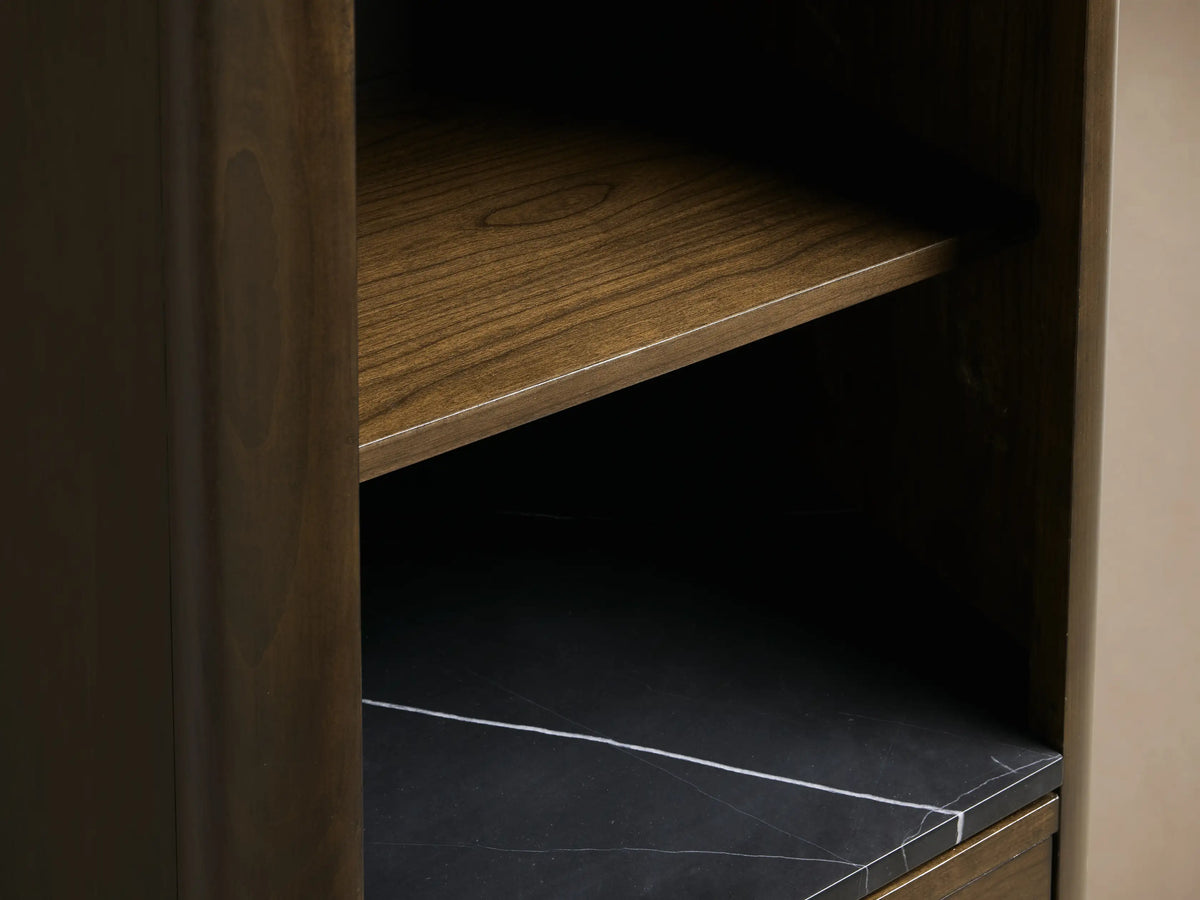 Laurent Tall Bath Cabinet, open drawer with white towels, dark Bahasa Brown wood, Black Marquina marble top, silver knob.