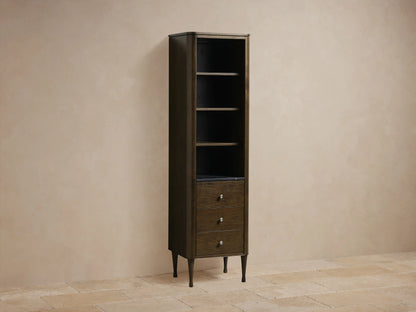 Close-up of Laurent Tall Bath Cabinet, showing a Bahasa Brown wooden shelf over black Marquina marble with white veins.