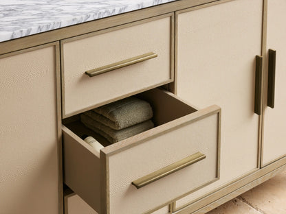 Malone Double Vanity: light oak, marble top. Textured cream drawers and open cabinet with bronze pulls, folded towels.