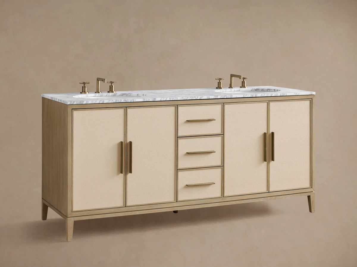 Malone Double Vanity: bone oak frame, beige shagreen-textured drawers with brass pulls, white marble top. One drawer open with towels.