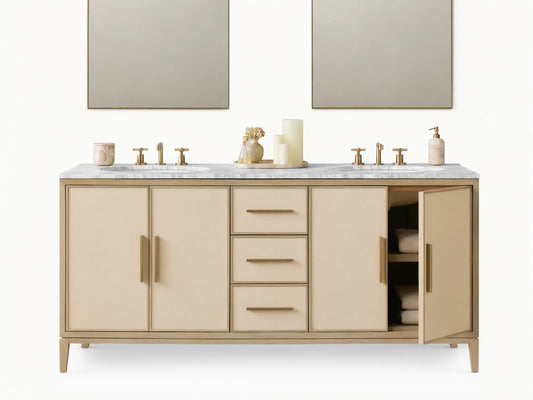 Malone Double Vanity in Bone finish. Light wood frame, cream shagreen cabinet doors & drawers with brass handles. White marble top.