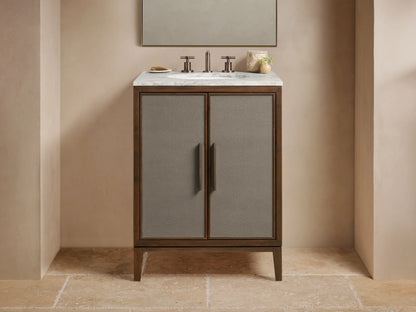 Malone Powder Vanity: Dark wood frame, gray shagreen cabinet doors, bronze handles, white marble top with faucet & sink.