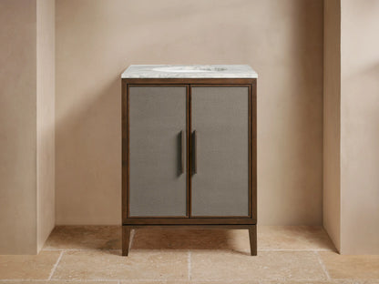 Malone Powder Vanity: Dark wood frame, gray shagreen cabinet doors, bronze handles, white marble top with faucet & sink.