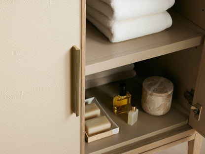 Close-up of Malone Single Vanity: white marble top with grey veining, oval ceramic undermount sink, 3 faucet holes.