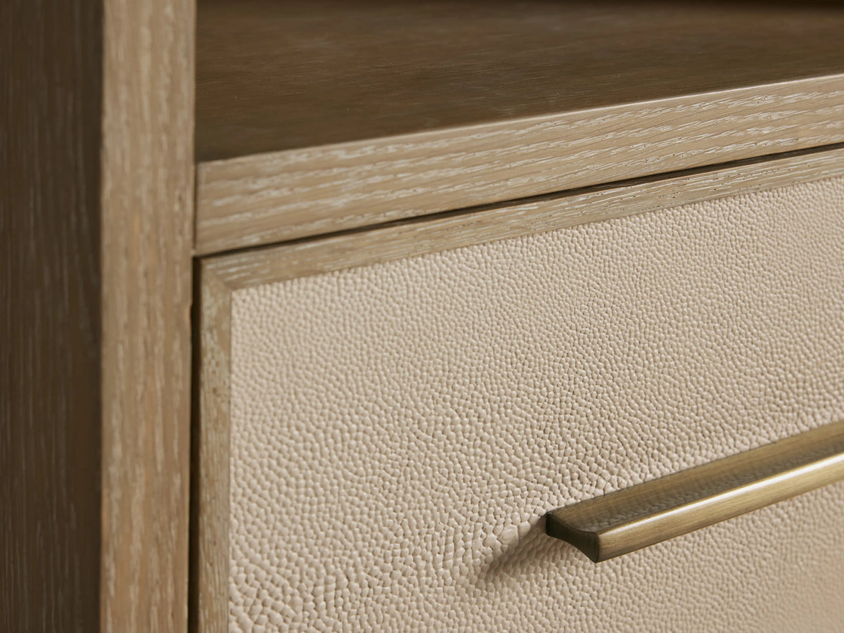 Malone Tall Bath Cabinet in Bone oak. Open drawer with beige faux shagreen front, antique brass pull, white towel inside.