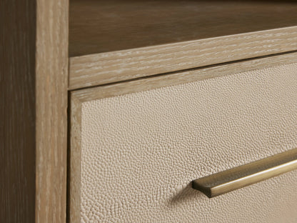 Malone Tall Bath Cabinet in Bone oak. Open drawer with beige faux shagreen front, antique brass pull, white towel inside.