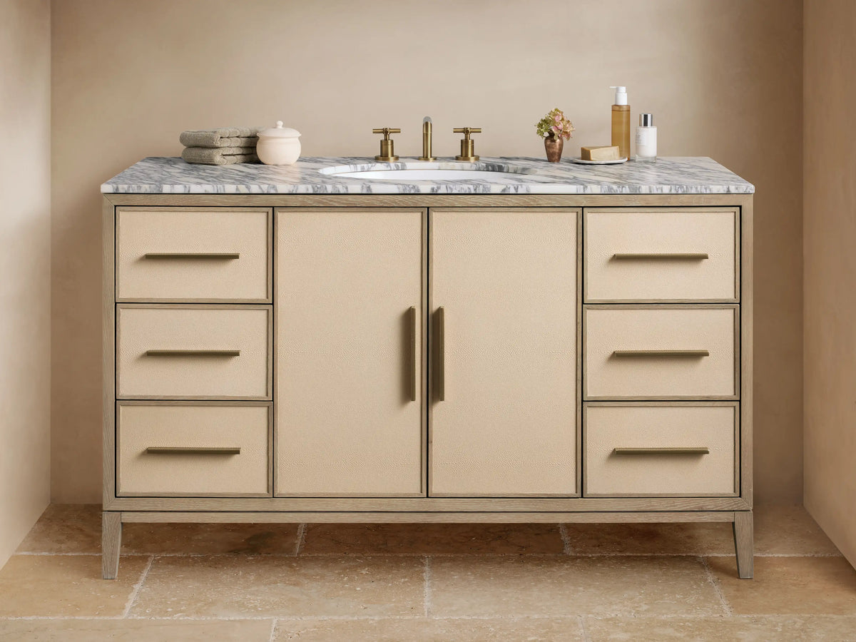 Malone Wide Single Vanity, bone oak frame, gray marble top, oval sink, brass faucet, bone shagreen panels, 6 drawers & 2 doors.