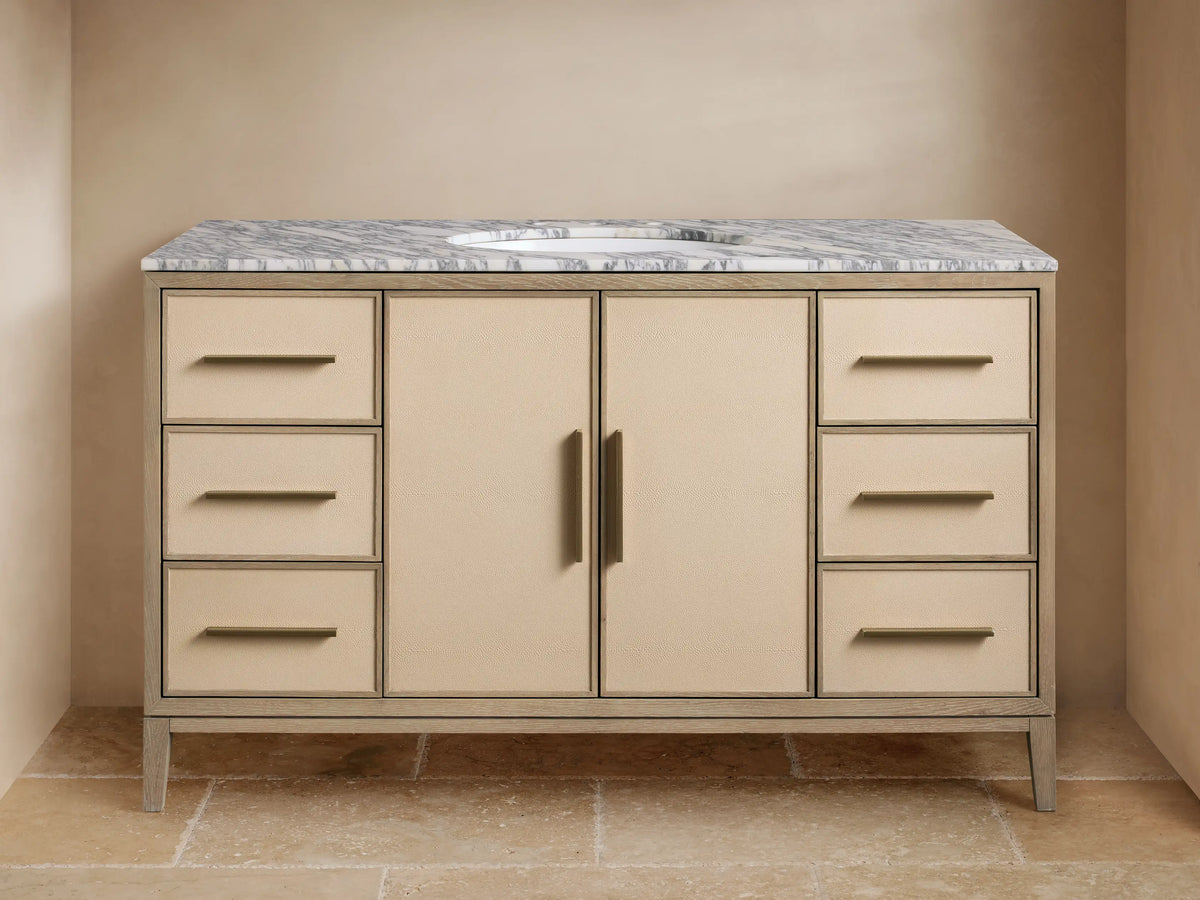 Malone Wide Single Vanity, bone oak frame, gray marble top, oval sink, brass faucet, bone shagreen panels, 6 drawers & 2 doors.