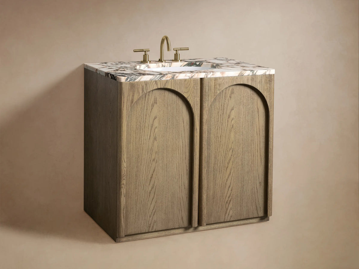 Provo Single Vanity with open oak cabinet, showing shelves with towels and items. Marble top features unique veining.
