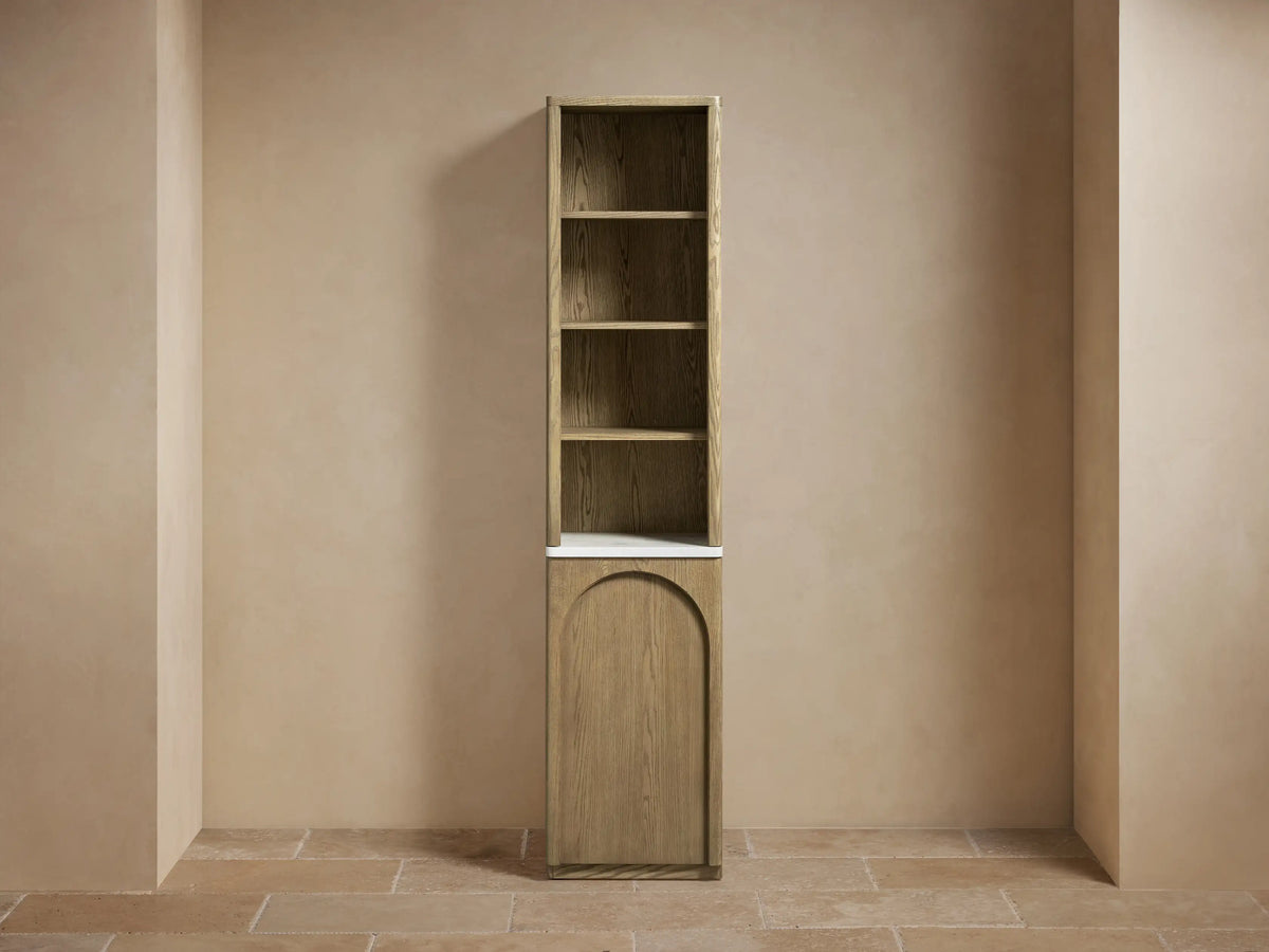 Provo Etagere crafted from oak wood with visible grain pattern. Features adjustable shelves, one holding folded white towels.