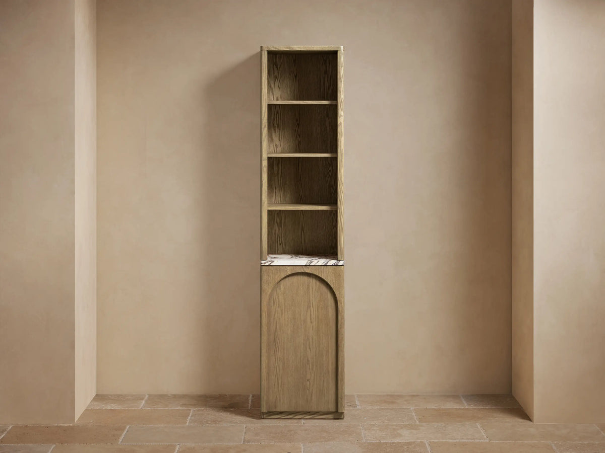 Provo Etagere with oak wood finish, featuring two shelves, one with folded beige towels, and a stone bottom shelf with marble pattern.