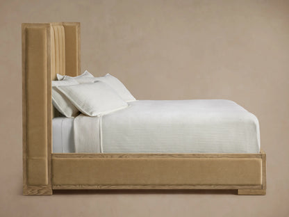 Close-up of Darien Channel-Stitched Shelter Bed headboard with tan vertical channel-stitched upholstery and light oak wood frame.
