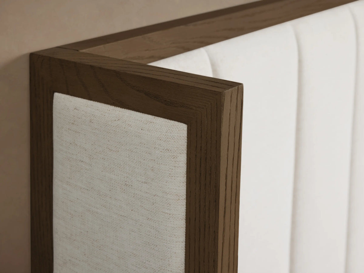 Front view of the Darien Channel-Stitched Shelter Bed featuring dark oak frame and white upholstered panels.
