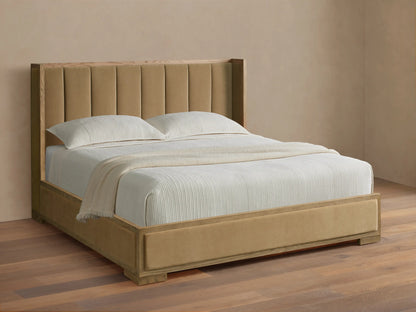 Darien Channel-Stitched Shelter Bed with tan upholstered headboard & footboard, light oak frame, white textured bedding on wood floor.