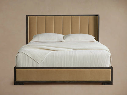 Darien Channel-Stitched Shelter Bed with a tall tan channel-stitched headboard & footboard, dark wood frame, and white bedding.