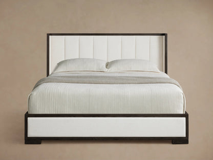 Darien Channel-Stitched Shelter Bed: dark wood frame, white channel-stitched headboard, upholstered sides, white bedding with gray throw.