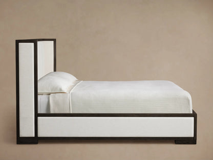 Angled close-up of Darien Channel-Stitched Shelter Bed; dark oak frame around light beige fabric panel & channel-stitched headboard.