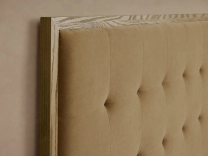 Darien Box-Tufted Panel Bed: Natural oak frame with warm tan upholstered panels, box-tufted headboard. White bedding.