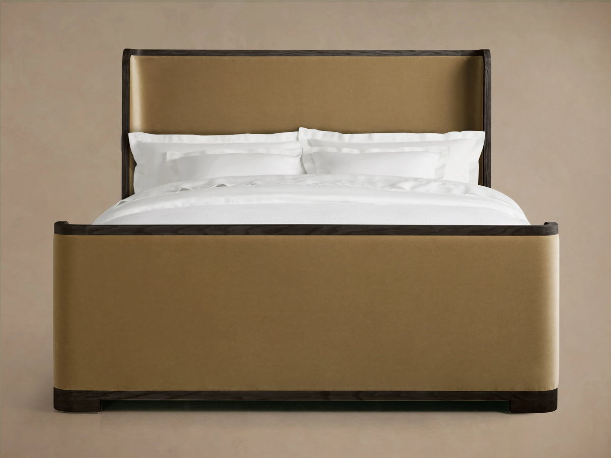 Darien Curved Shelter Bed with high footboard, featuring oak wood frame and upholstered panels, with white bedding.