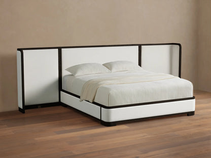 Darien Extended Curved Shelter Bed with white upholstered frame and a wide, dark-trimmed curved headboard, white bedding.