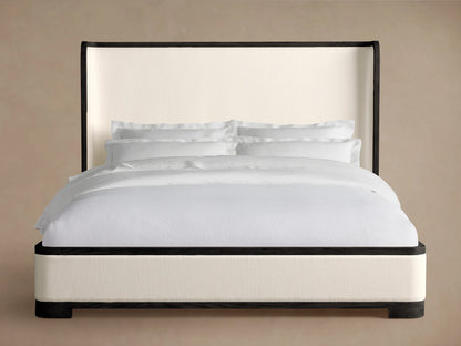 Darien Curved Shelter Bed with Low Footboard features oak wood frame, upholstered panels, and a soft white bedding set.