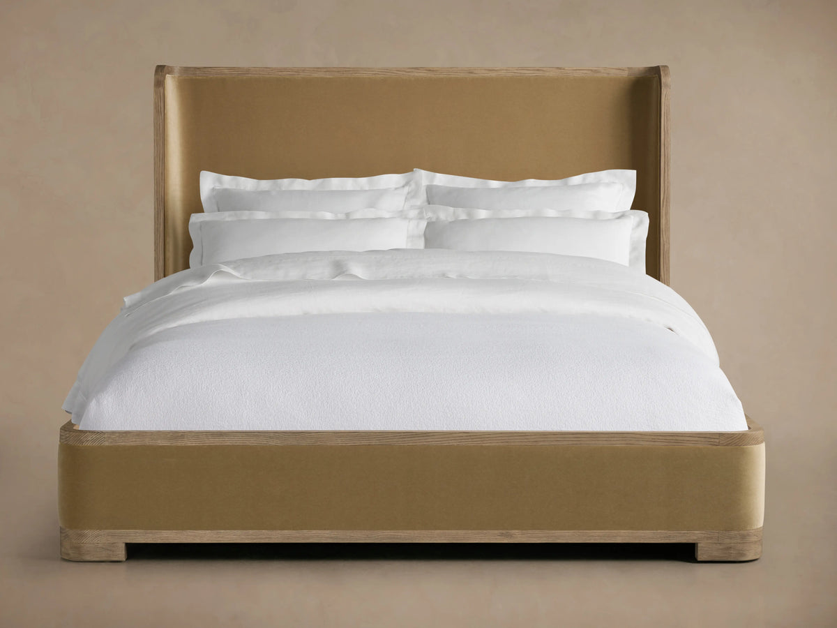 Darien Curved Shelter Bed with Low Footboard, oak veneer, solid oak, hand-applied finish, upholstered panels, white bedding.