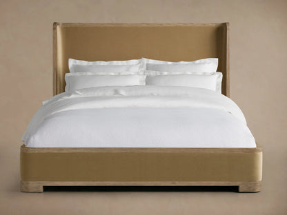Darien Curved Shelter Bed with Low Footboard, oak veneer, solid oak, hand-applied finish, upholstered panels, white bedding.