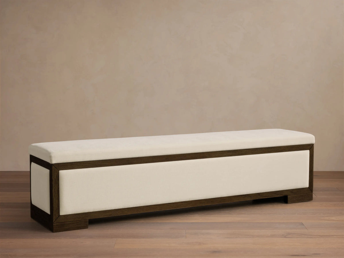 Front view of the Darien Storage Bench with dark oak wood frame and oatmeal upholstered top and side panel.
