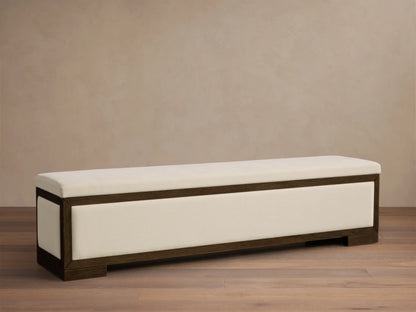 Front view of the Darien Storage Bench, with a cream upholstered top and front panel, framed by dark oak wood.