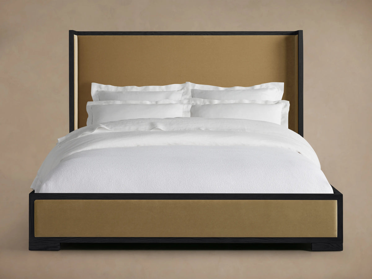 Darien Shelter Bed with Low Footboard features a high upholstered headboard and low footboard in brown with a white bedding set.