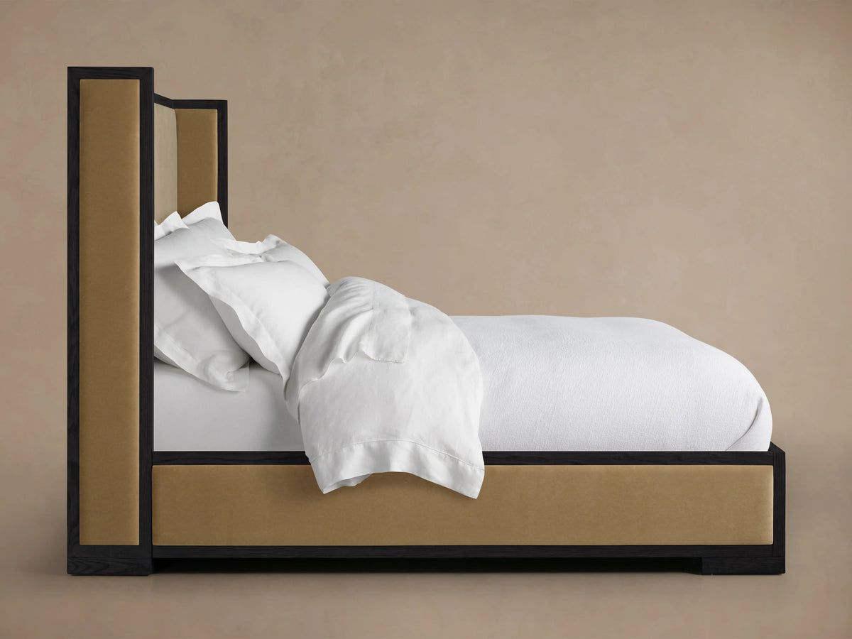Darien Shelter Bed with low footboard, featuring oak wood frame, upholstered panels, and a white mattress with white bedding.