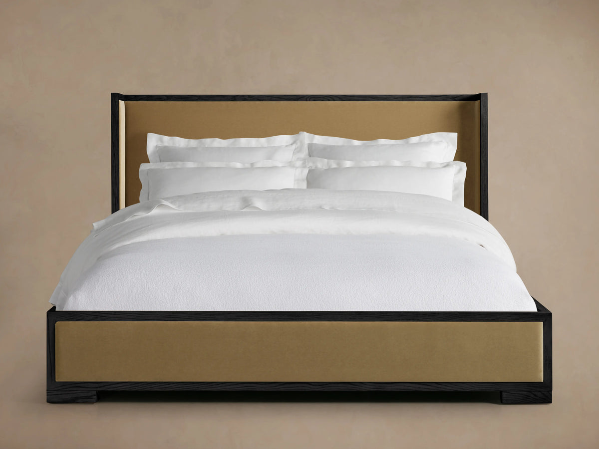 Darien Shelter Bed with low footboard, featuring oak veneer and solid wood frame, upholstered panels, and white bedding.