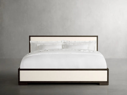 Darien Panel Bed with Low Footboard featuring a white upholstered headboard and footboard, dark wood frame, and white bedding.