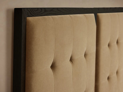 Darien Extended Box-Tufted Panel Bed with three tan upholstered, box-tufted panels & dark wood frame, white bedding.