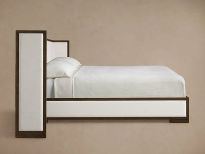 Side profile of a dark brown wood and off-white upholstered Darien Extended Box-Tufted Shelter Bed.