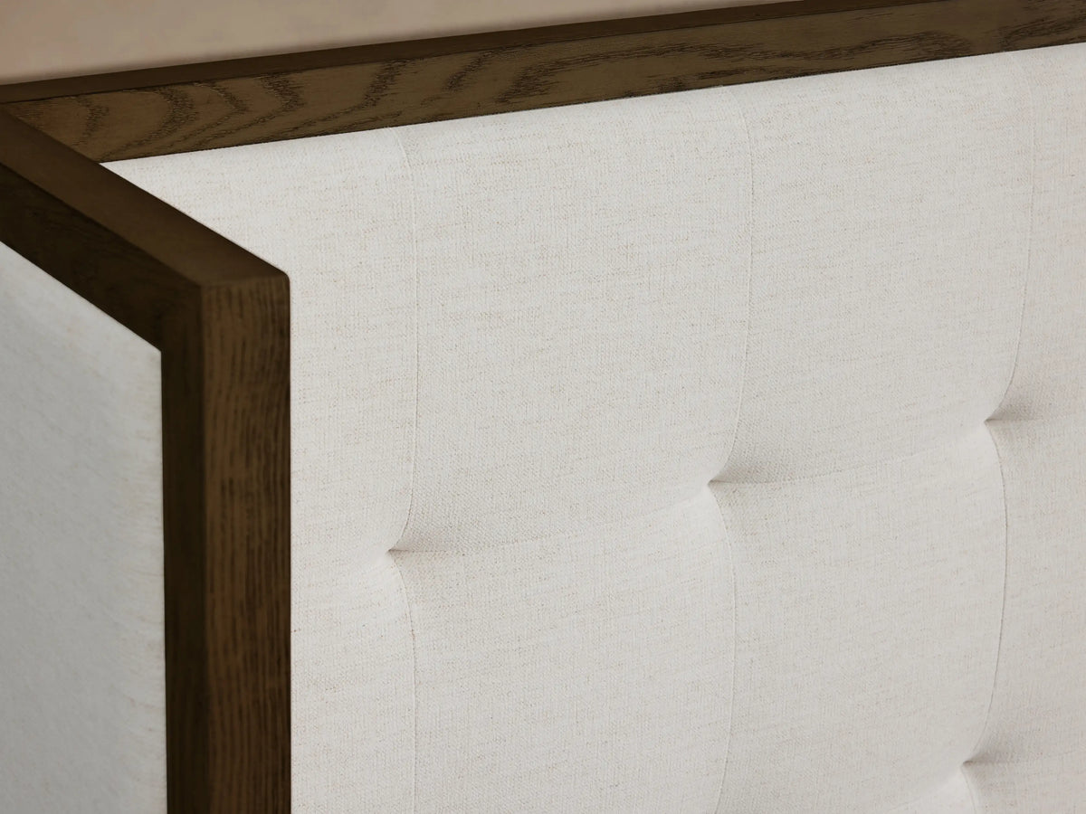 Front view of the Darien Extended Box-Tufted Shelter Bed with white upholstered, box-tufted panels and a dark wood frame.