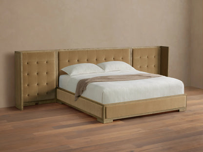 Darien extended shelter bed with light oak frame, camel box-tufted upholstery, white bedding, on a wood floor.