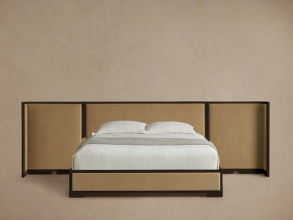 Darien Extended Shelter Bed with dark oak frame, tan upholstered headboard & frame, white bedding, gray throw, wood floor.