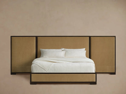 Darien Extended Panel Bed with dark wood frame and tan upholstered extended headboard and bed frame, dressed in white.
